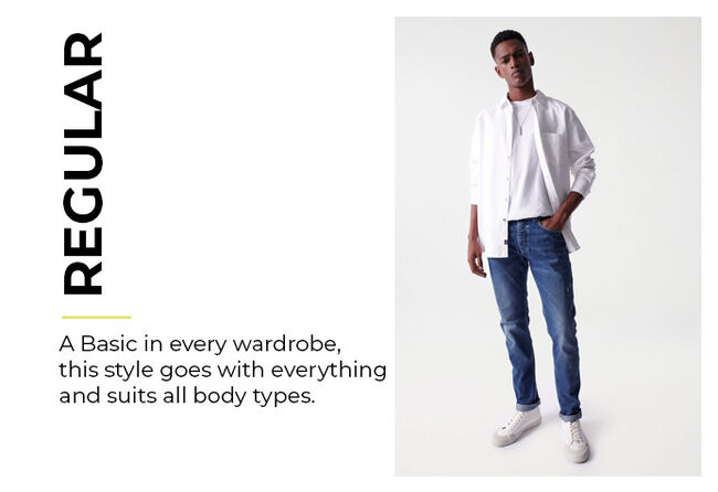 man in medium-dark blue regular fit jeans