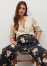 Mango - light beige Flowy printed trousers Mango - light beige Flowy printed trousers